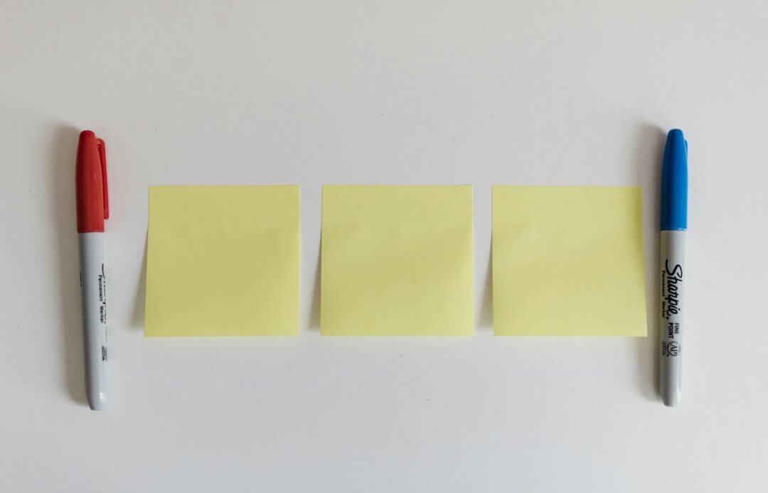 Team planning session with sticky notes on a glass wall